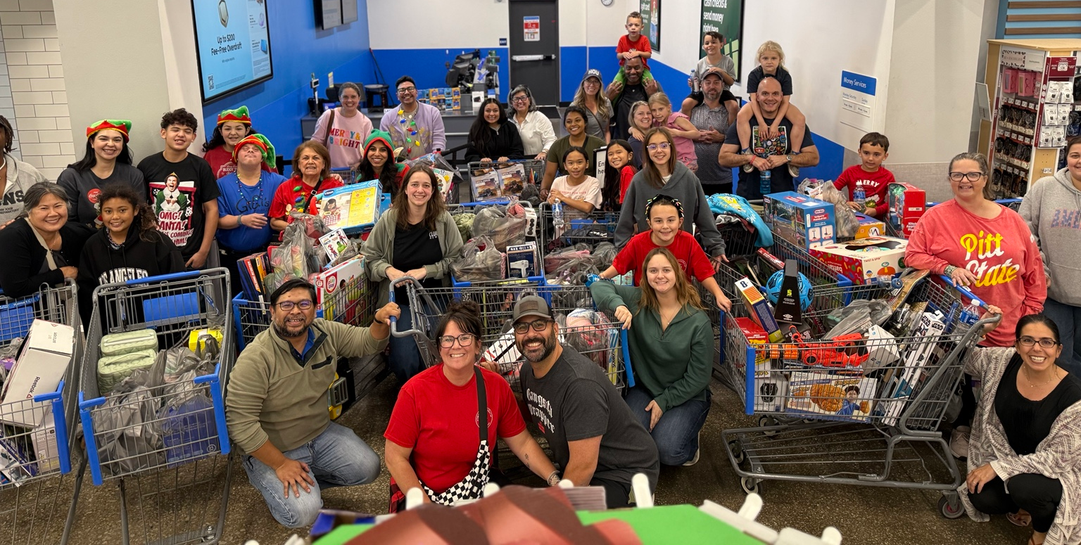 Benjamin's Blessings tenth annual toy drive homepage, featuring the large mammoth logo, our volunteers and their carts of donated toys, and our $20,000 fundraising goal